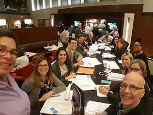 Selfie of Forefront staff and Illinois foundation leaders at FOTH during a table discussion.